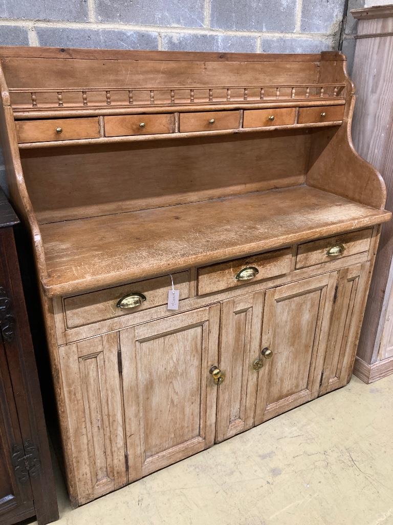 A Victorian pine dresser (lacks rack), length 138cm, depth 52cm, height 152cm